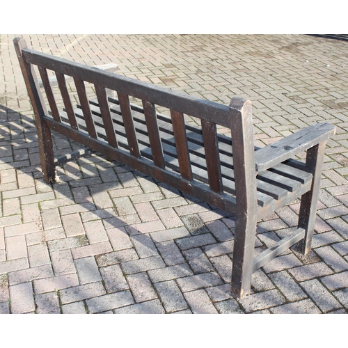 357 - A wooden garden bench, approx 158cm wide, with plaque