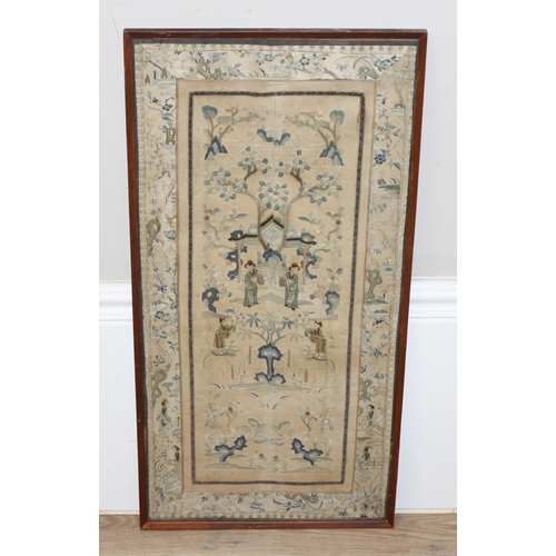 459T - A framed Chinese embroidered needlework panel, a batik style print of a deity and a carved reticulat... 