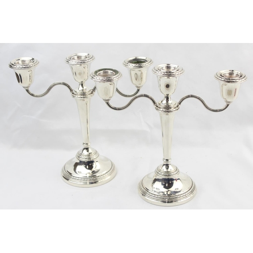 1062 - A pair of silver metamorphic 3 branch candelabras able to unscrew and convert to single candlesticks... 