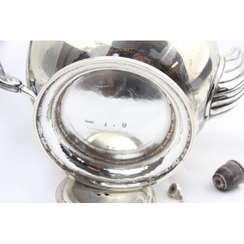 1065 - An early 19th century German silver teapot of rounded form, various marks to base including the Dres... 