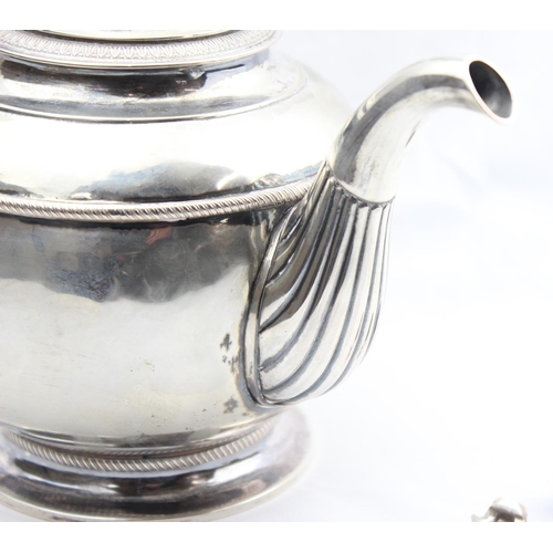 1065 - An early 19th century German silver teapot of rounded form, various marks to base including the Dres... 