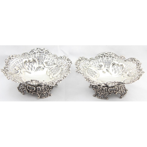 1067 - A pair of Victorian silver pierced bonbon dishes, London 1892 by William Comyns, each approx 13cm in... 