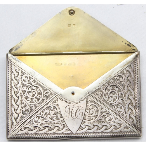 1068 - An Edwardian silver card case formed as an envelope with profuse engraved decoration, marked for Bir... 