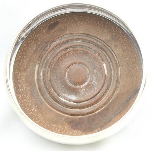 1069 - A vintage wooden and silver wine bottle coaster, London 1987 by M C Hersey & Son Ltd, approx 13cm in... 