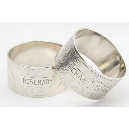 1075 - A pair of heavy gauge silver napkin ring with engraved bamboo design, named Rosemary & Michael, mark... 