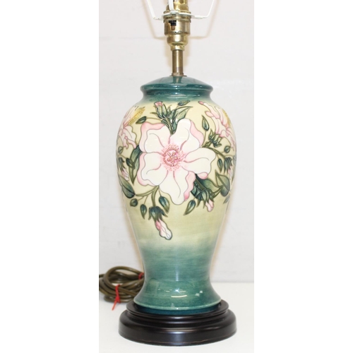 246 - A Moorcroft table lamp in the Hibiscus Moon pattern, with original shade, approx 58cm tall inc shade