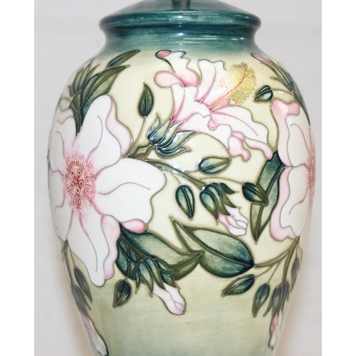 246 - A Moorcroft table lamp in the Hibiscus Moon pattern, with original shade, approx 58cm tall inc shade