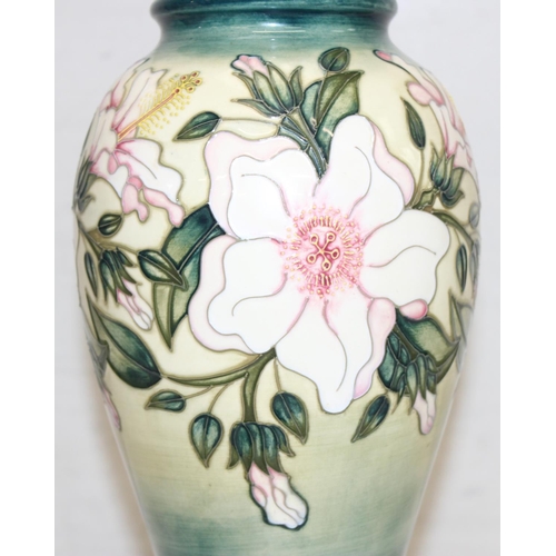 246 - A Moorcroft table lamp in the Hibiscus Moon pattern, with original shade, approx 58cm tall inc shade