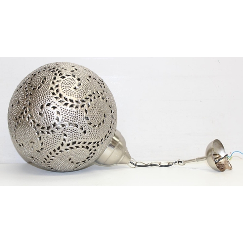 259A - A large Moroccan silver coloured metal pierced spherical pendant light, like a large Christmas Baubl... 