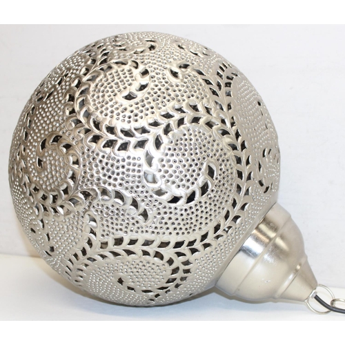 259A - A large Moroccan silver coloured metal pierced spherical pendant light, like a large Christmas Baubl... 