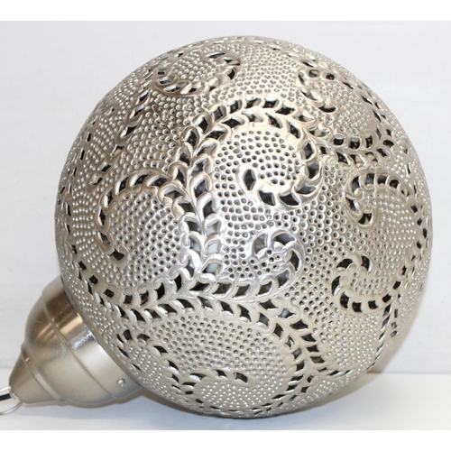 259A - A large Moroccan silver coloured metal pierced spherical pendant light, like a large Christmas Baubl... 