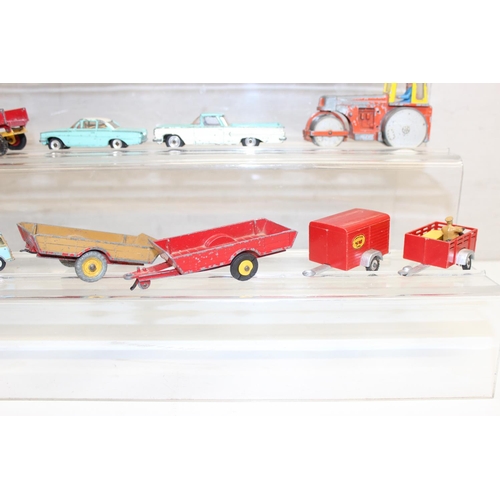 708 - A large qty of assorted vintage Dinky Toys die-cast vehicles, playworn