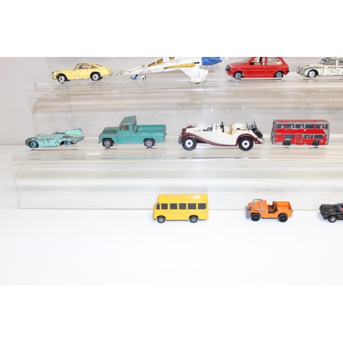 709 - A large qty of assorted vintage Corgi Toys die-cast vehicles, playworn