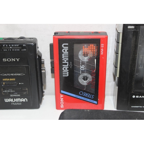 803 - 4 Vintage Walkman's to include Sony WM22, Sanyo M 1001, Sanyo MGR69 and a Sony WM-F2068