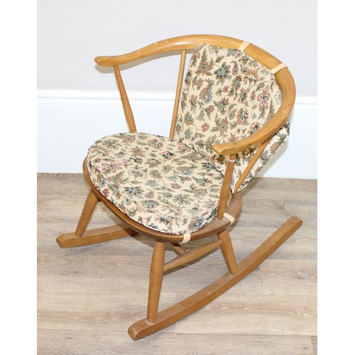 13 - Ercol - a retro low hoop backed rocking armchair with mid-century floral cushions, small child sized... 