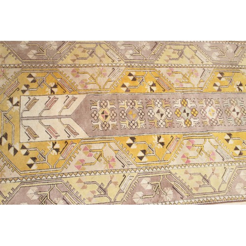 212 - A vintage Oushak yellow ground Turkish rug, label verso for Lapis of Istanbul, approx 210cm x 110cm