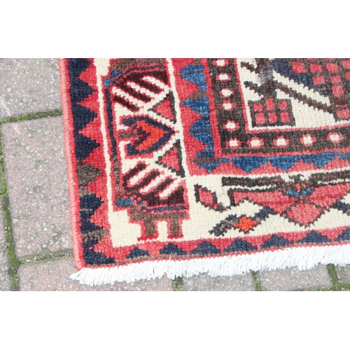 211 - A large vintage Bakhtiari rug of red ground, with decorative squared panels, approx 240cm x 140cm