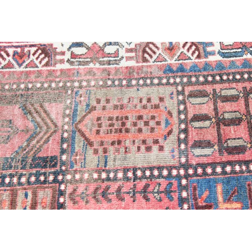 211 - A large vintage Bakhtiari rug of red ground, with decorative squared panels, approx 240cm x 140cm