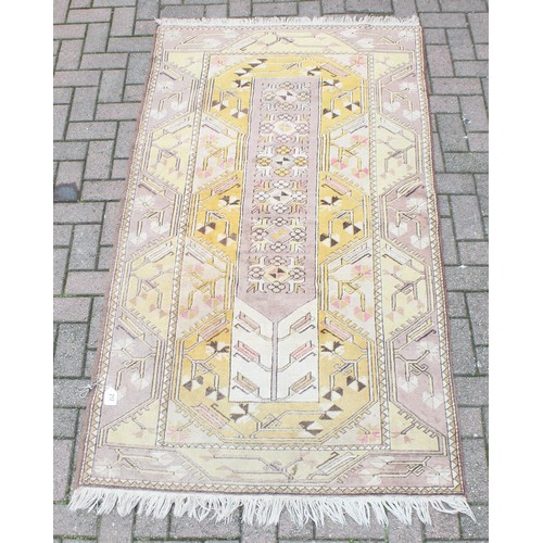 212 - A vintage Oushak yellow ground Turkish rug, label verso for Lapis of Istanbul, approx 210cm x 110cm