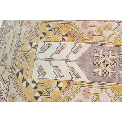 212 - A vintage Oushak yellow ground Turkish rug, label verso for Lapis of Istanbul, approx 210cm x 110cm