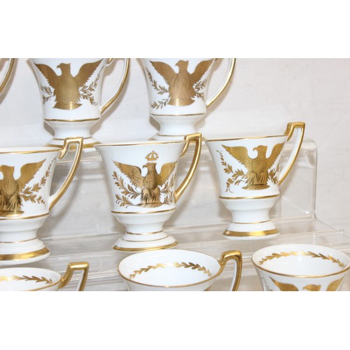 1567 - An extensive qty of Limoges gilt decorated coffee cups and saucers, decorated in the Napoleonic peri... 