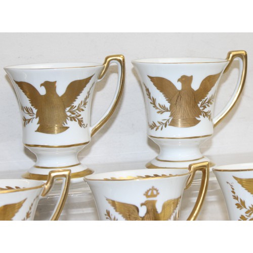 1567 - An extensive qty of Limoges gilt decorated coffee cups and saucers, decorated in the Napoleonic peri... 