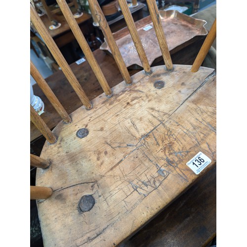 136 - An unusual antique stick back chair with elm seat, possibly a Welsh yoke backed chair, 19th century ... 