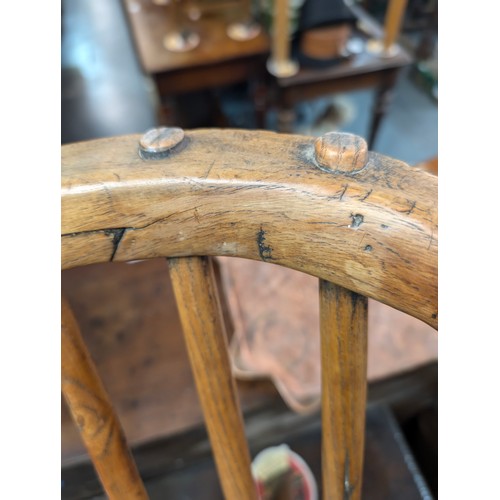 136 - An unusual antique stick back chair with elm seat, possibly a Welsh yoke backed chair, 19th century ... 