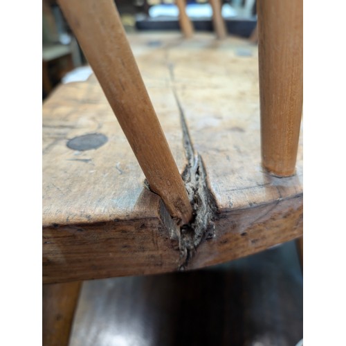 136 - An unusual antique stick back chair with elm seat, possibly a Welsh yoke backed chair, 19th century ... 