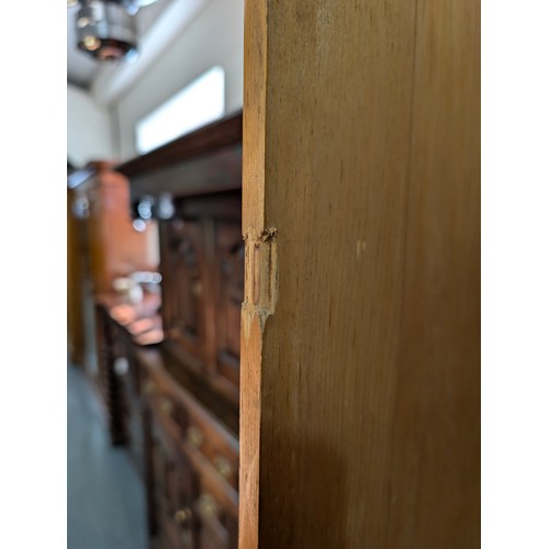 61 - A Victorian hall or housekeepers cupboard of large proportions, either satinwood or pine, a large co... 