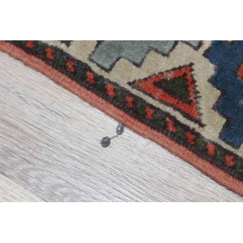 200 - A vintage multi-coloured Turkish made hand knotted rug, approx 147cm x 110cm