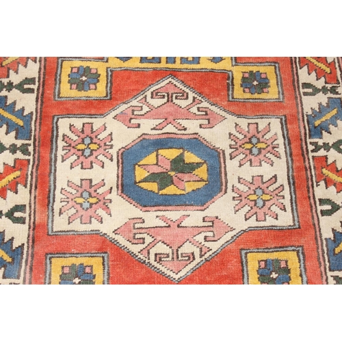 201 - A vintage multi-coloured hand knotted rug, likely Turkish, approx 153cm x 102cm