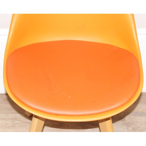 112 - A harlequin set of 3 colourful moulded plastic chairs with wooden legs, all seemingly unmarked, appr... 