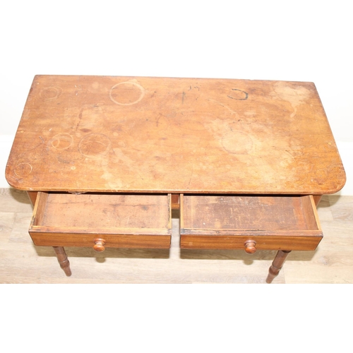 117 - A Victorian mahogany 2 drawer side table or hall table with turned legs and bun handles, approx 94cm... 