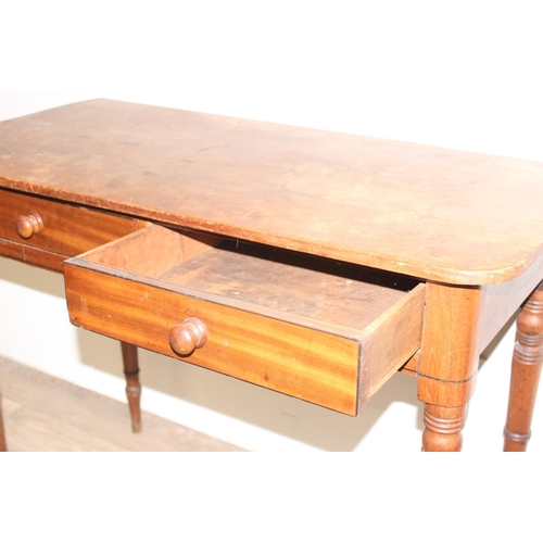 117 - A Victorian mahogany 2 drawer side table or hall table with turned legs and bun handles, approx 94cm... 