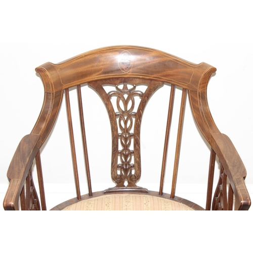 125 - An Edwardian mahogany tub chair with pierced fretwork back, inlaid details and reeded legs, approx 5... 