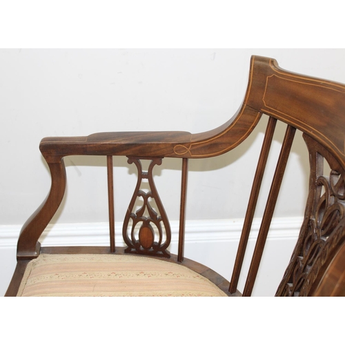 125 - An Edwardian mahogany tub chair with pierced fretwork back, inlaid details and reeded legs, approx 5... 