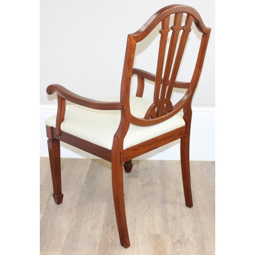 48 - A pair of 20th century hardwood armchairs, believed to be from Hong Kong, with carved shield shaped ... 