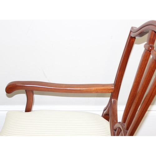 48 - A pair of 20th century hardwood armchairs, believed to be from Hong Kong, with carved shield shaped ... 