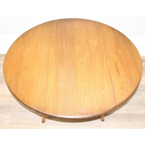 124 - Ercol elm topped drop leaf dining table with oval top, Golden Dawn finish, gold label, approx 113cm ... 