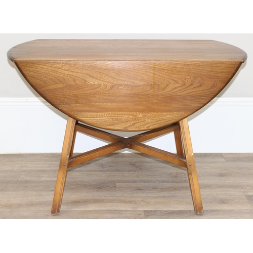 124 - Ercol elm topped drop leaf dining table with oval top, Golden Dawn finish, gold label, approx 113cm ... 