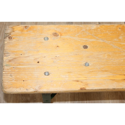 61 - A vintage wooden topped bench with folding metal legs, previously from Carter's Steam Fair, approx 1... 