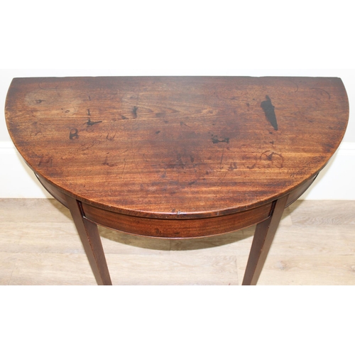 126 - A Georgian mahogany demi-lune side table with square tapered legs, approx 107cm wide x 54cm deep x 7... 