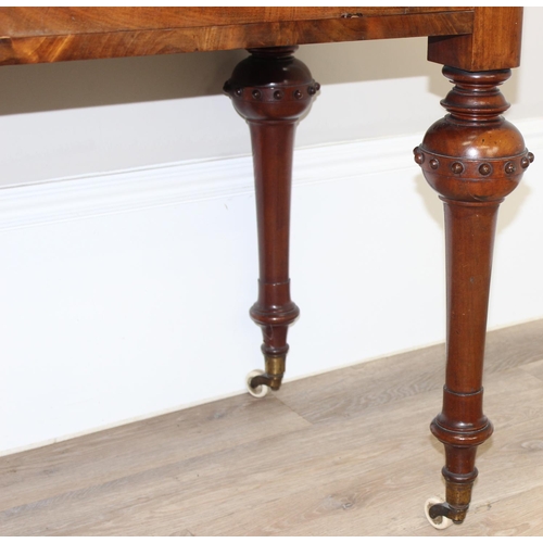 137 - A superb quality Victorian mahogany desk or side table with 2 drawers, standing on unusual legs deco... 