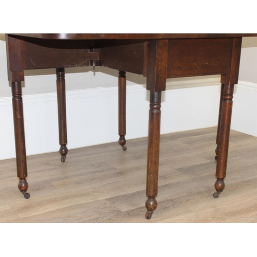 119 - An antique mahogany drop leaf table with turned legs and brass and ceramic castors, approx 100cm wid... 