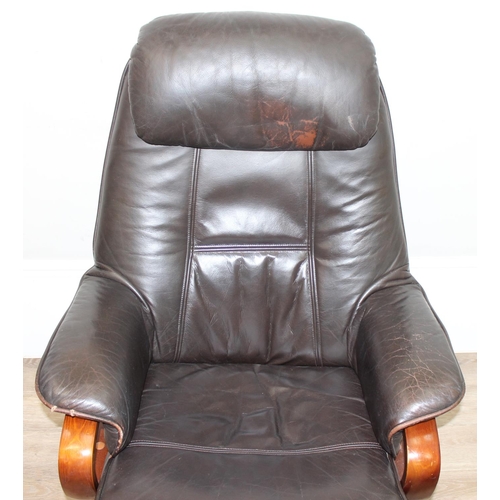 3 - An Ekornes style retro brown leather reclining armchair with wooden base by Global Furniture Allianc... 