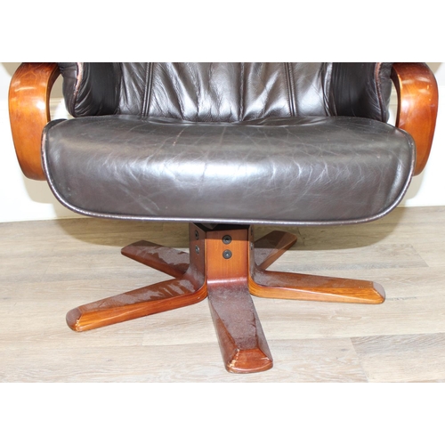 3 - An Ekornes style retro brown leather reclining armchair with wooden base by Global Furniture Allianc... 