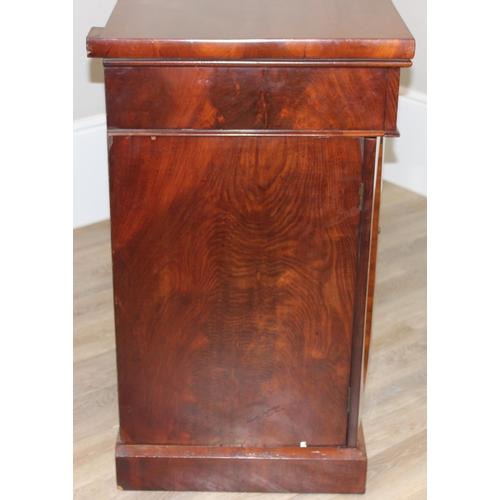 35 - A Victorian mahogany breakfront sideboard, 2 side cupboards flanking a central cupboard, one of the ... 