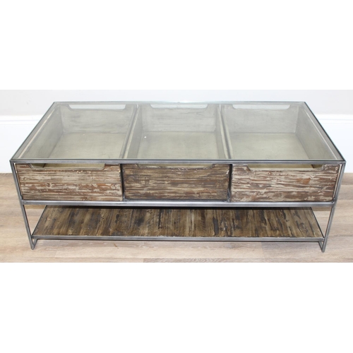 49 - An unusual industrial style reclaimed wooden, metal and glass bijouterie coffee table, the 3 drawers... 