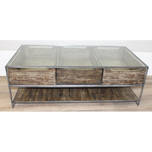 49 - An unusual industrial style reclaimed wooden, metal and glass bijouterie coffee table, the 3 drawers... 